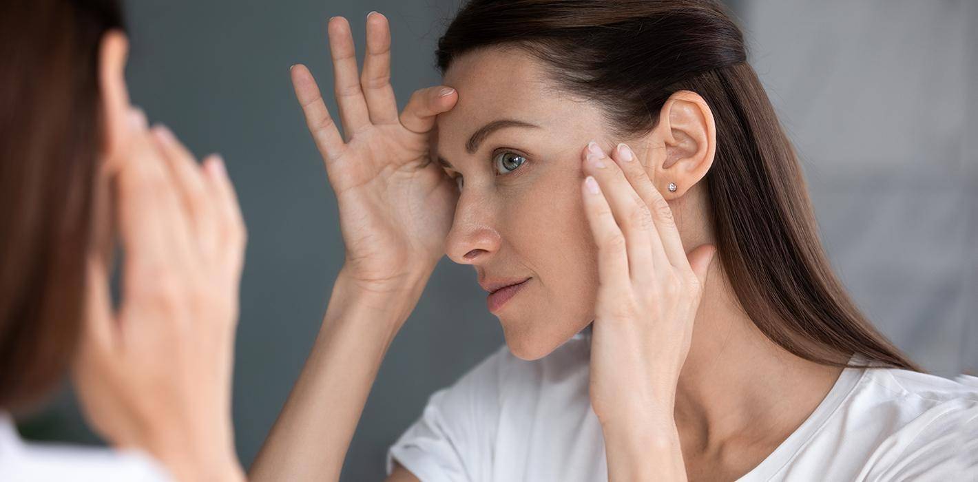 Woman checking her skin